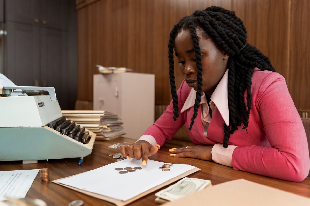 portfolio-06 A businesswoman in vintage attire counts coins in a retro office setting.